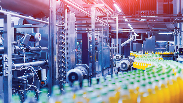 Beverage factory interior. Conveyor with bottles for juice or water. Equipments Factory producing food